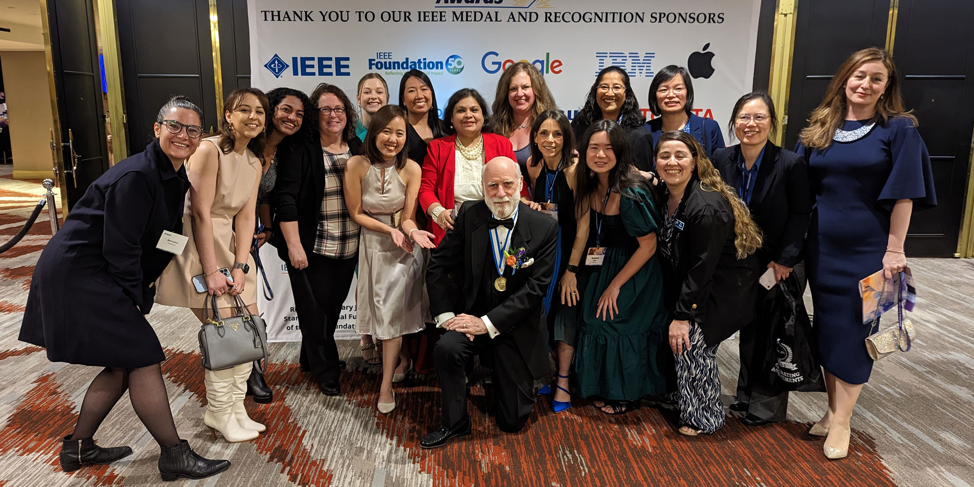 Group image of Women in Engineering at the IEEE Awards ceremony with Vint Cerf